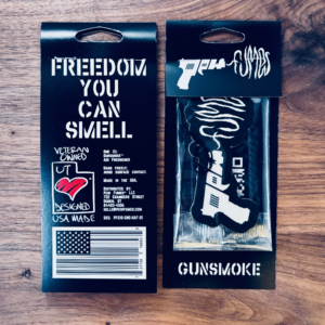 Gunsmoke hanging air freshener, showing front and back of packagin
